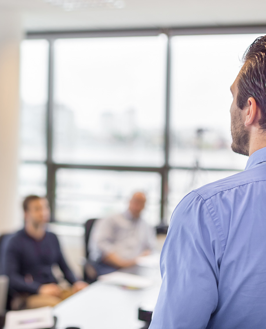 Man teaching course in classroom