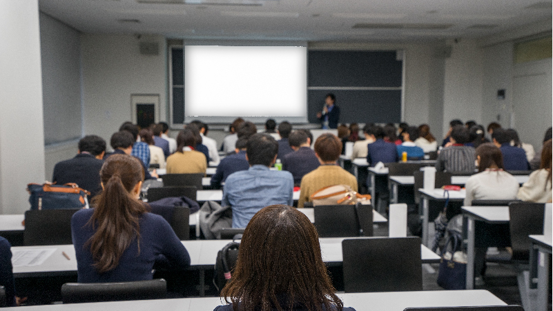 Adults sitting in classroom listening to a lecture